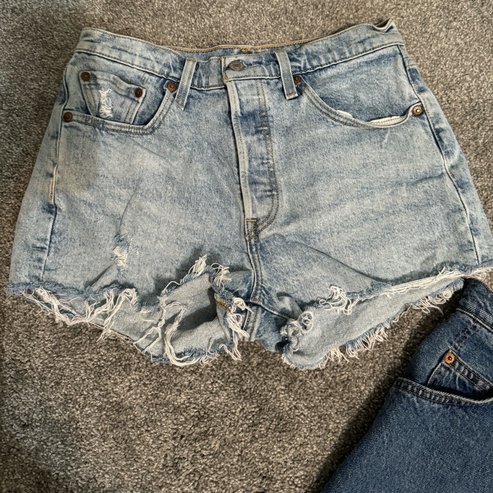 Button up Levi distressed shorts.